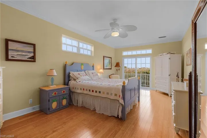 The primary bedroom has bamboo floors, plenty of natural light, and an open deck for nature viewing and breezes.