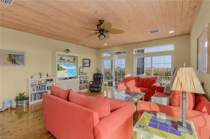 The cypress floor and pine ceiling provide a warm tropical feel while the three sets of sliding glass doors provide lots of natural light.