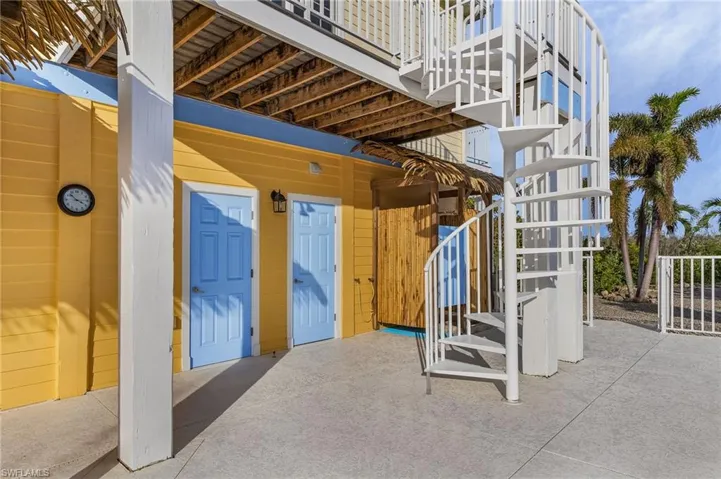 Swimmers will enjoy the outside tiki shower and dressing area.
