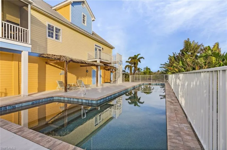 50' x 10' lap pool, with shallow ledge for toddlers and sunbathers.  Enjoy relaxing out of the sun under the tiki.