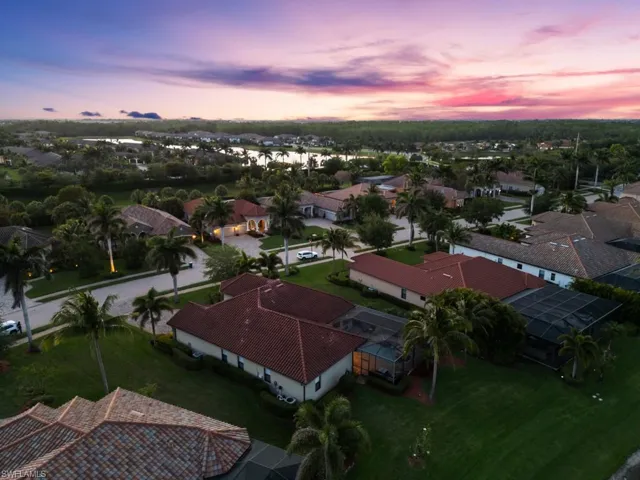 Aerial view at dusk featuring a residential view