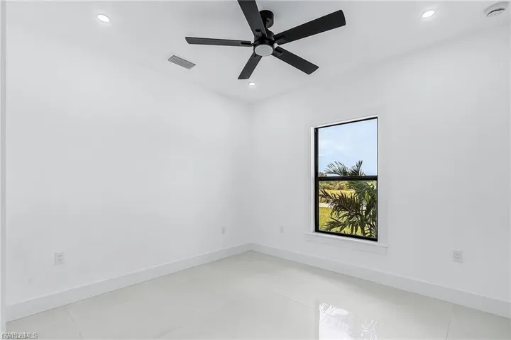 Spare room with ceiling fan and recessed lighting