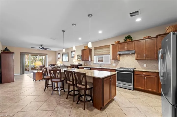 View of kitchen/great room from foyer hallway