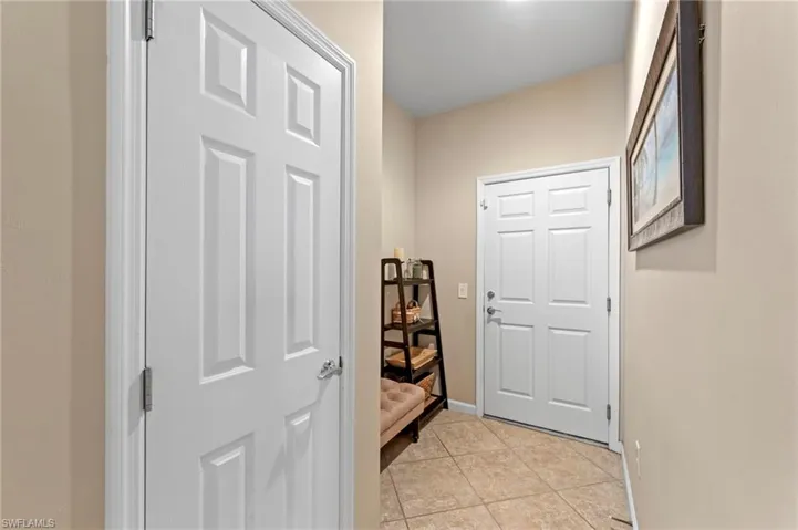 Door to garage, door to left is closet