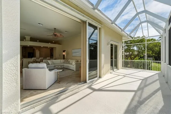 Sunroom featuring a patio, ceiling fan, and outdoor lounge area