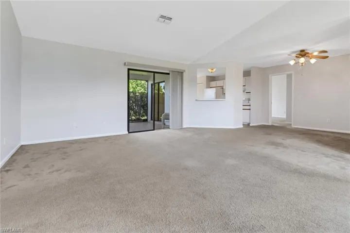 Unfurnished room with visible vents, baseboards, and carpet floors