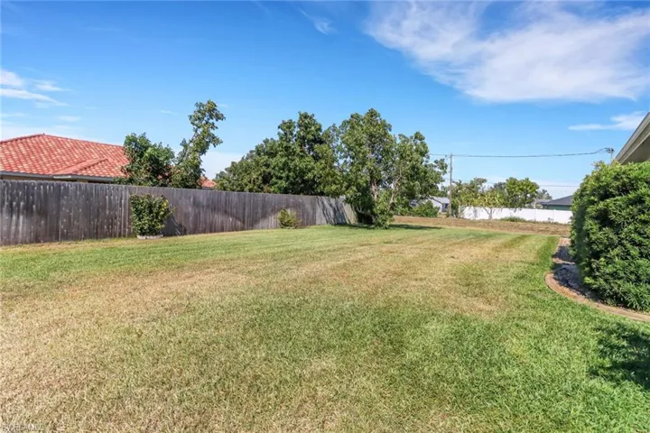 View of yard featuring a fenced backyard