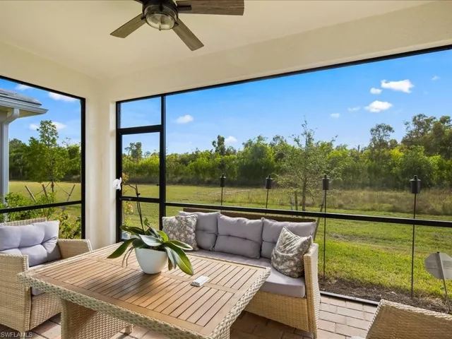 Sunroom featuring ceiling fan