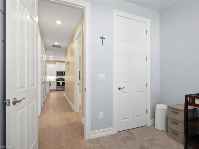 Hall featuring light hardwood / wood-style floors