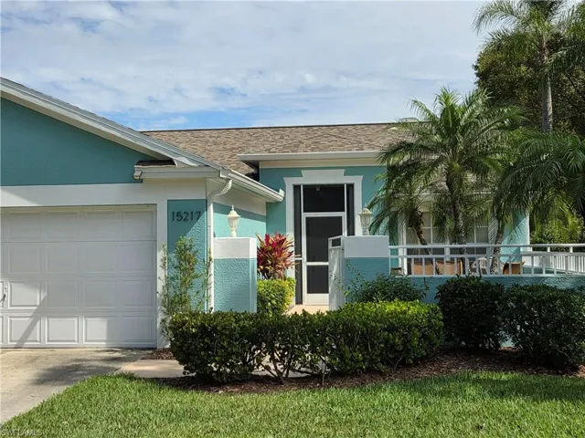 View of front of home featuring stucco siding, concrete driveway, and a garage