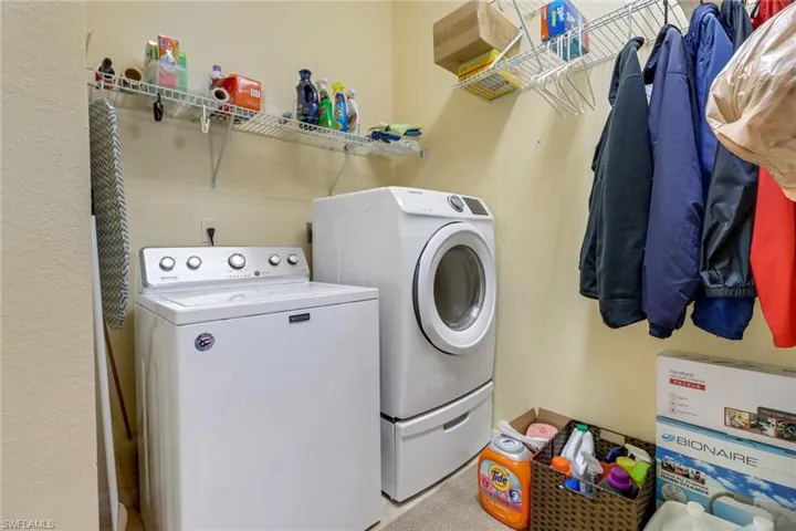 Washroom featuring independent washer and dryer