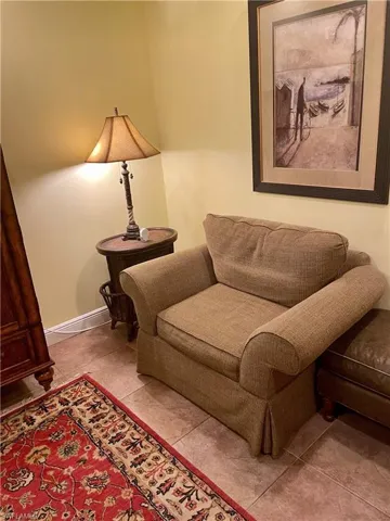 Living area with tile patterned floors and baseboards