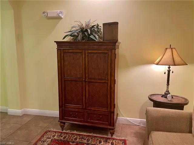 Living area with tile patterned flooring and baseboards
