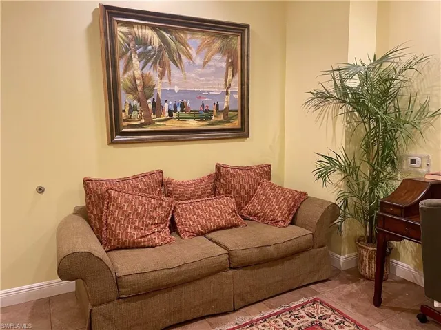 Living area with tile patterned floors and baseboards