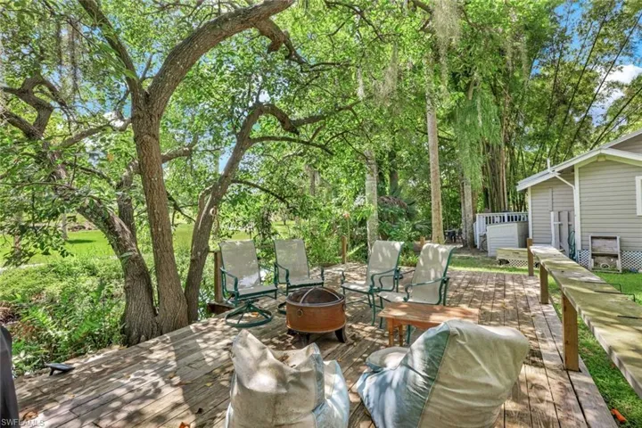 Wooden dock sits creekside with access to Imperial River just minutes away.