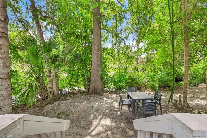 Property features just under half an acre of stunning landscaping and privacy.