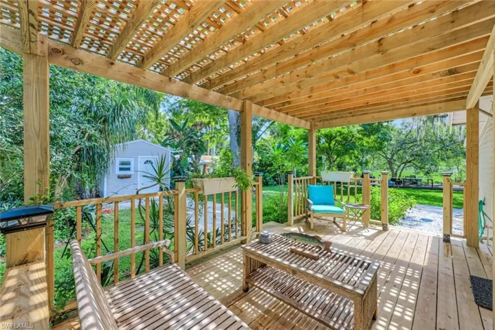 Covered patio, located just off the kitchen, is the perfect spot gather with family and friends.