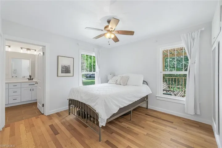 This large primary bedroom with en suite bathroom will be your retreat following a day at the beach!
