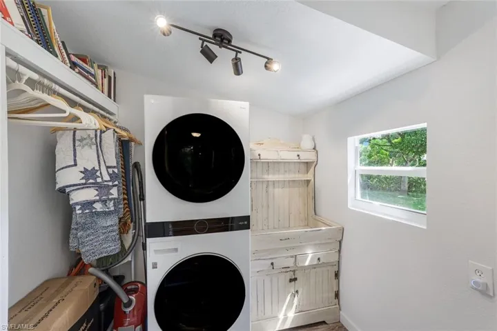 Spacious laundry room is located just off the main hallway.
