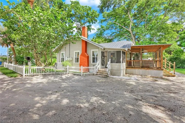 Welcome home to 27131/135 S. Riverside Drive! TWO separate homes on almost half an acre!