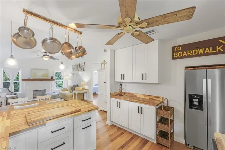 Upgraded wood floors, shaker cabinets, & open great room all overlooking lush landscaping.