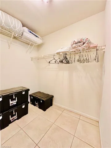 Spacious closet featuring light tile patterned floors