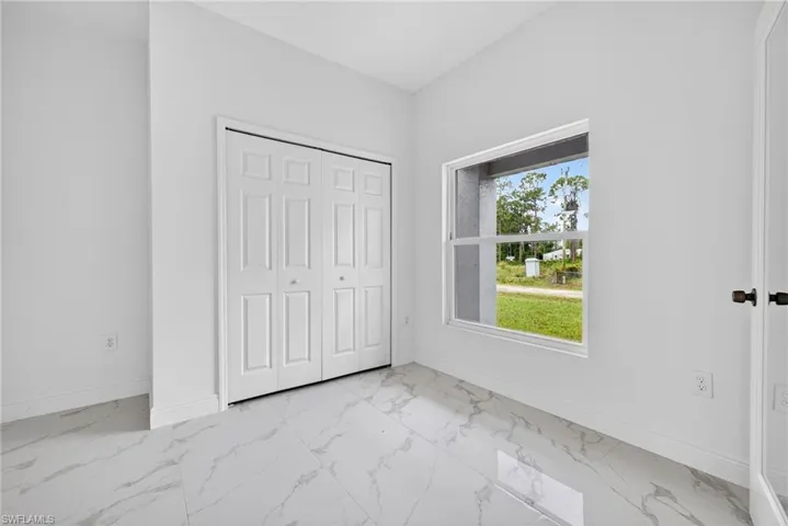 Cozy den or home office featuring a stylish double-door entrance.