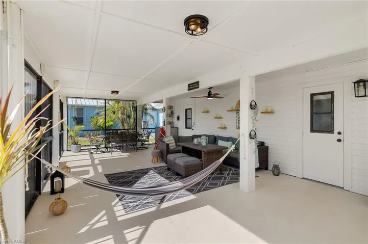 First level screened patio with access to the exercise room, bathroom and garage.