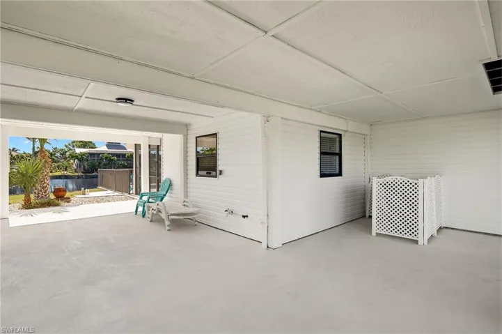 Side patio ~ use for extra outdoor living or park your golf cart!