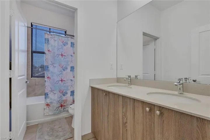 Full guest bathroom with tub and shower combo, dual sinks!