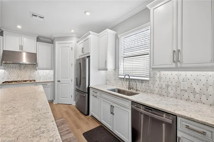 white cabinets, and light backsplash