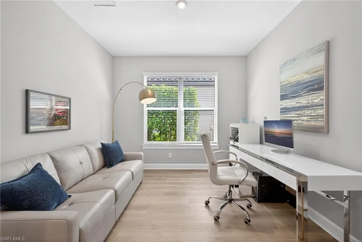 Office area featuring light wood finished floors and baseboards