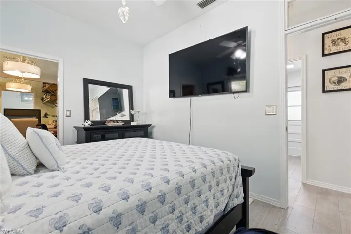 Bedroom featuring visible vents, baseboards, and a walk in closet