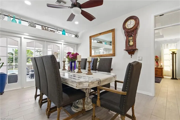 Dining space featuring a healthy amount of sunlight, light wood finished floors, and a ceiling fan