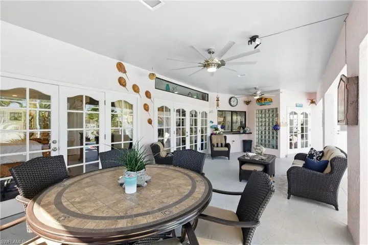 Sunroom / solarium featuring french doors