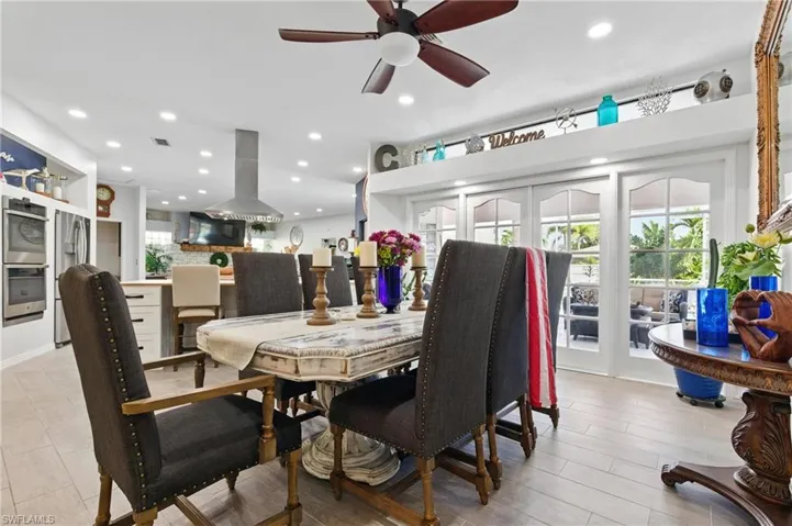 Dining area with ceiling fan, visible vents, and recessed lighting