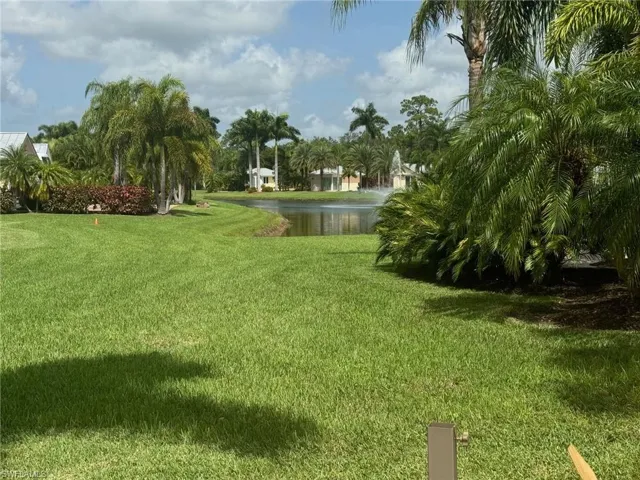 View of yard with a water view