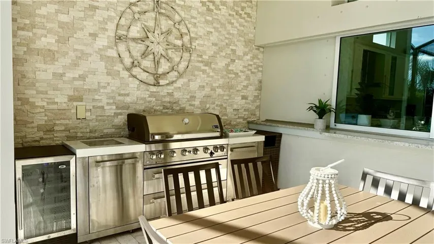 outdoor kitchen has a brand new commercial grill!
