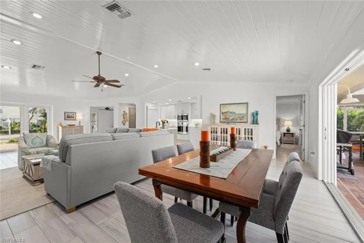Dining area with recessed lighting, wood ceiling, visible vents, and vaulted ceiling