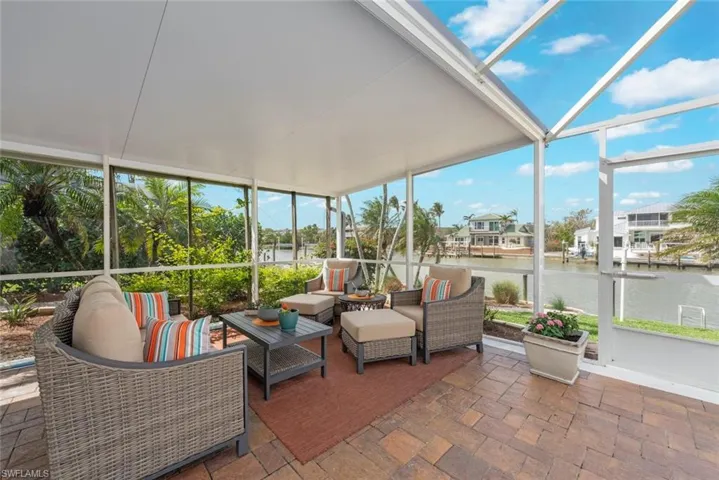 Sunroom / solarium with a water view