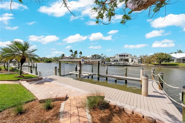 View of dock with a water view and boat lift