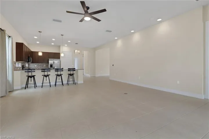 View from the rear of the home by the sliding doors; 19.6 x 20 with 10 ft ceilings