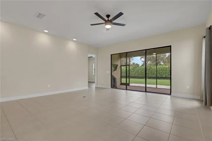 Door to the left leads to the primary bedroom; 19.6 x 20 with 10 ft ceilings