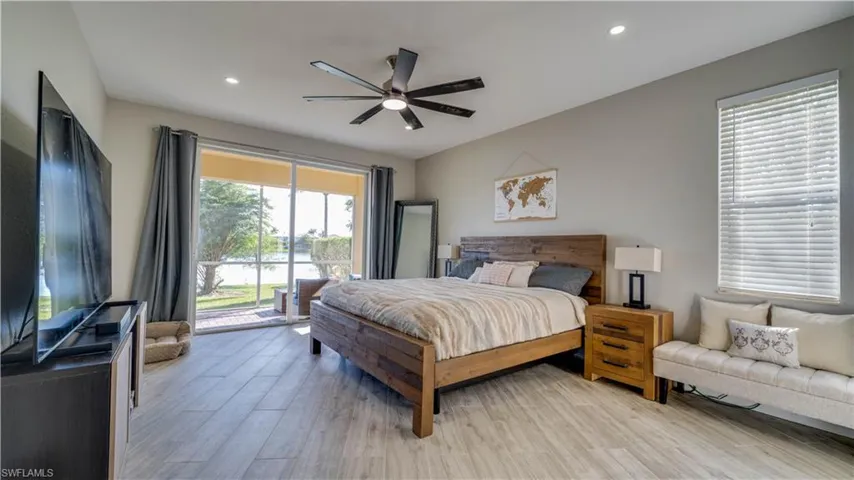 Master Suite with sliders to outside & view of lake