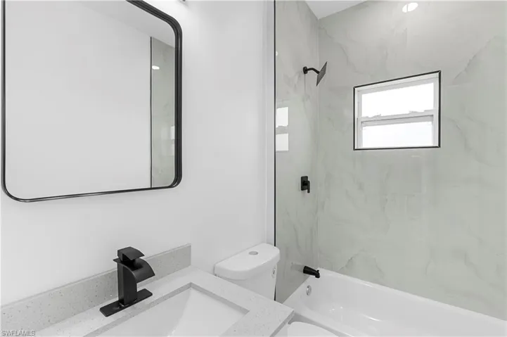 Full bath with shower / bathtub combination and vanity