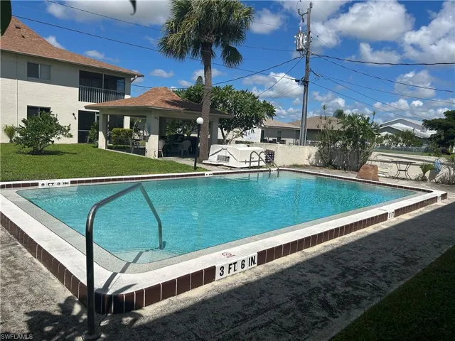 Community pool with a patio and a gazebo