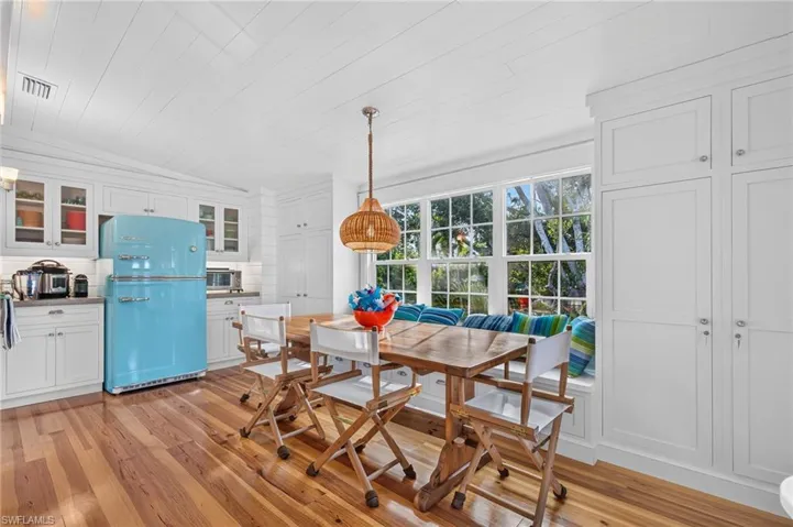 The dining area with its vintage-inspired refrigerator is relaxed and cozy