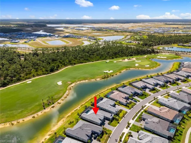 Birds eye view of property with a water view, a residential view, and golf course view