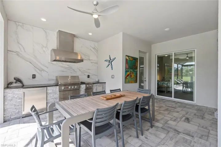 Dining room with recessed lighting and a ceiling fan