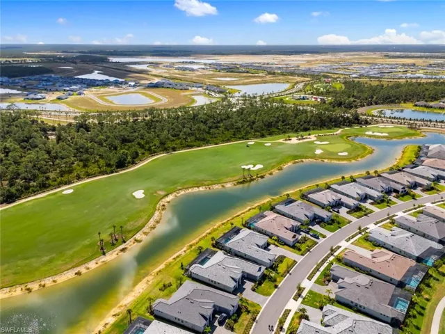 Drone / aerial view featuring a water view, a residential view, and golf course view
